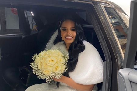 bride_in_car_with_bouquet.jpeg