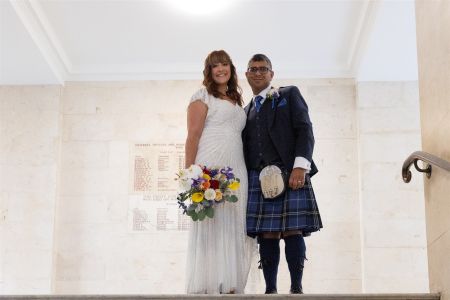 wedding_couple_standing_stairs.jpeg